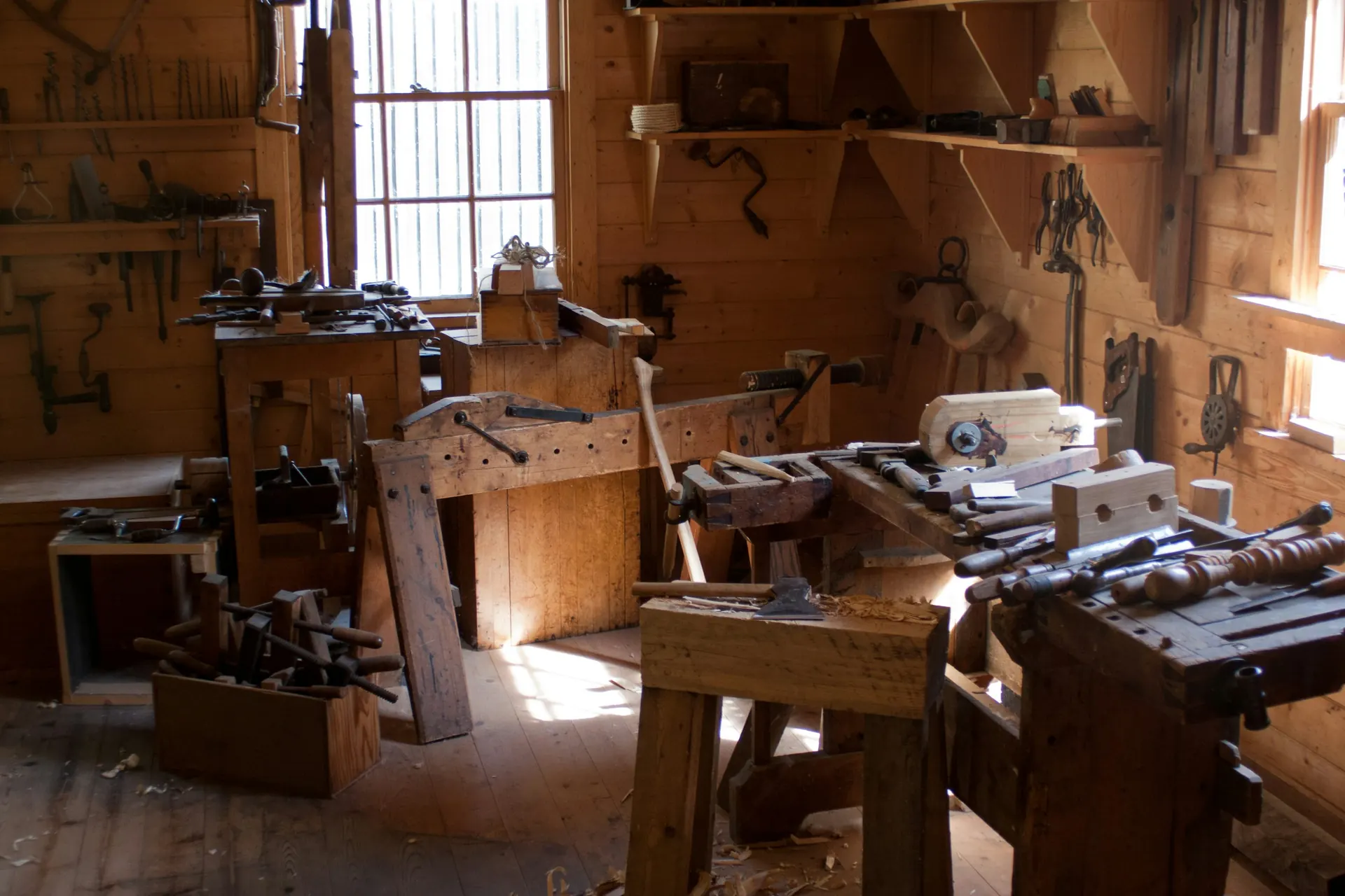 Warm woodworking workshop with a DIY workbench